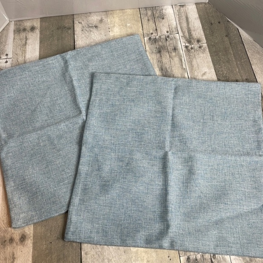 Nwot.  Set of 2 light blue, textured throw pillow cases. Same front & back 17x17